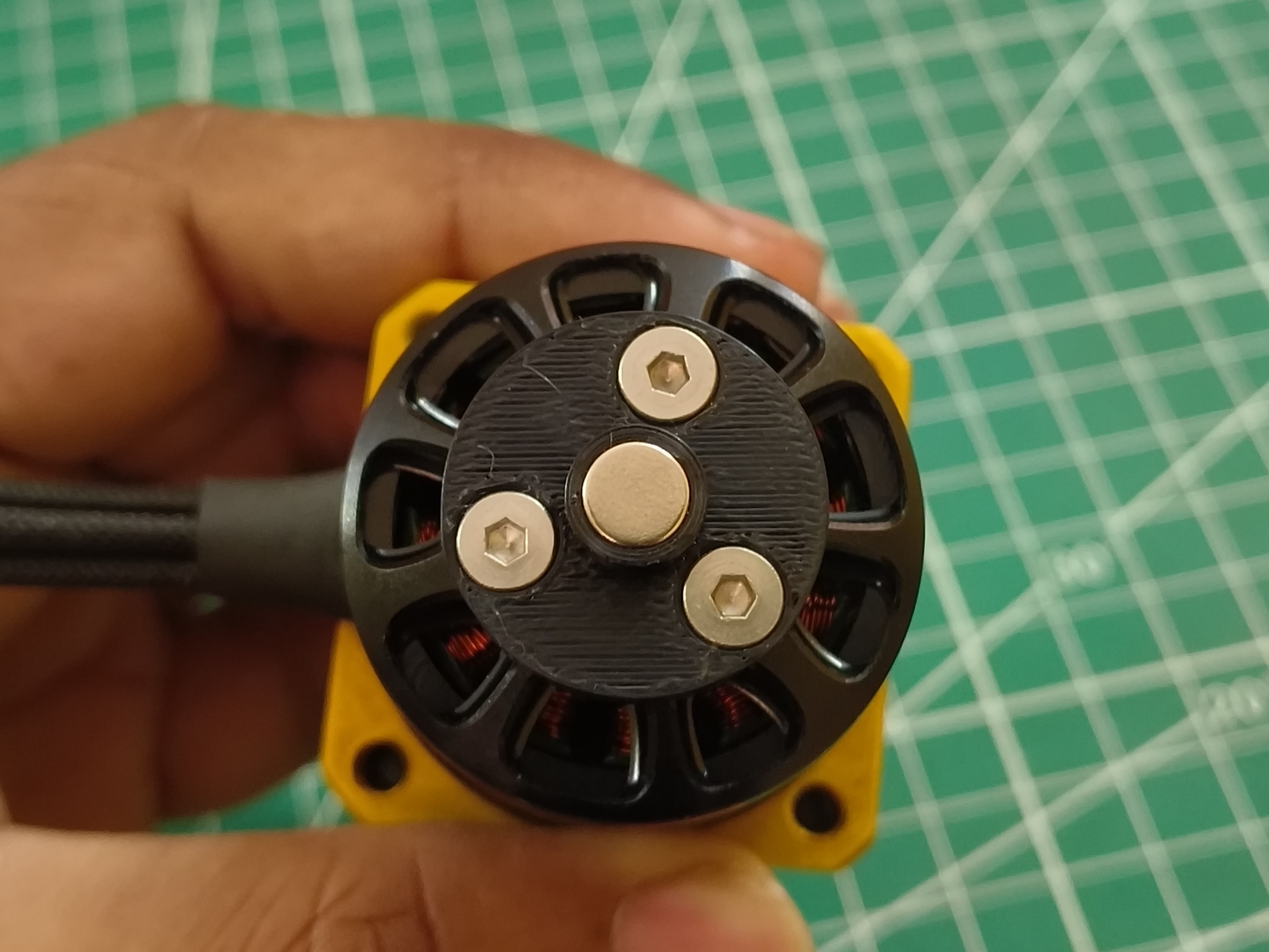 Magnet holder placed over the rear shaft.